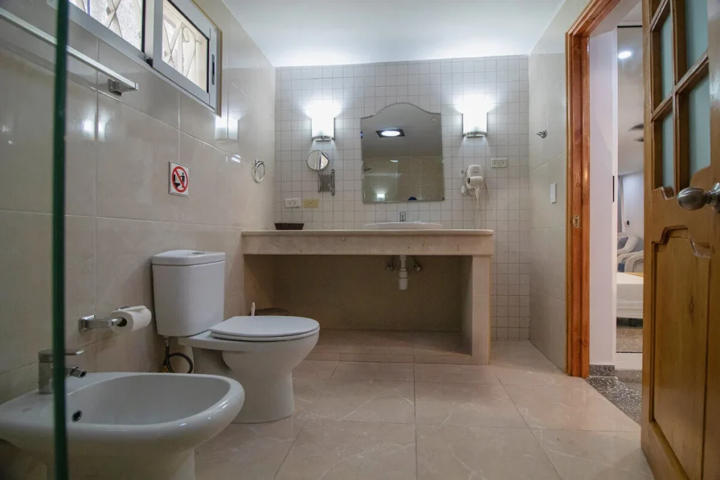 Glass shower and vanity in a Villa Don bathroom