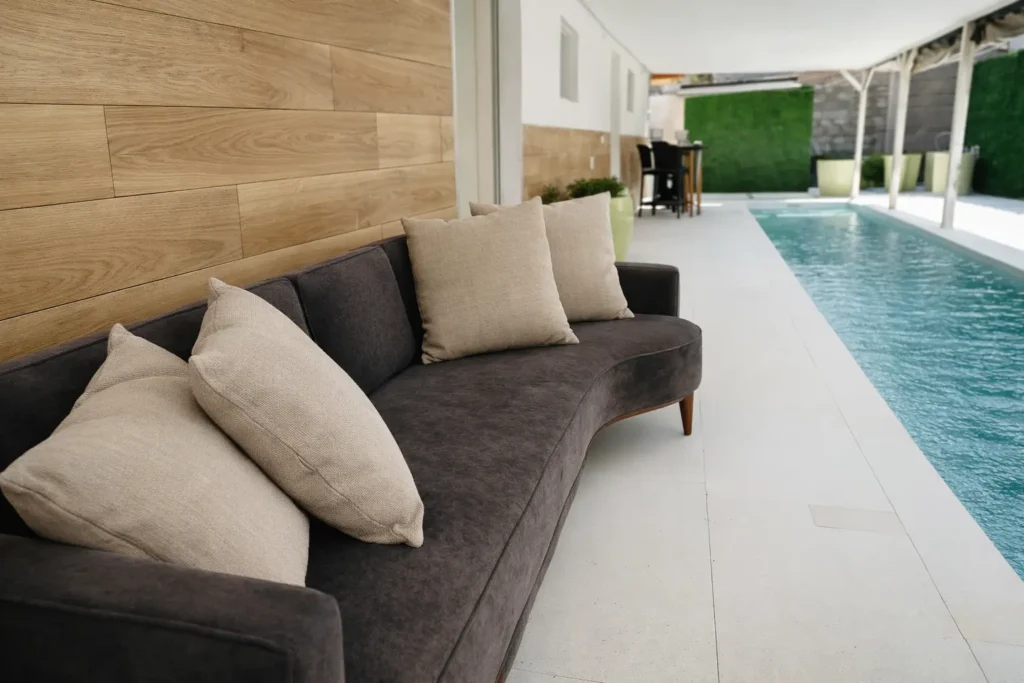 Covered outdoor sofa beside the Villa Dream pool