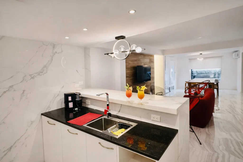 Kitchen island opening towards the lounge at Villa Dream