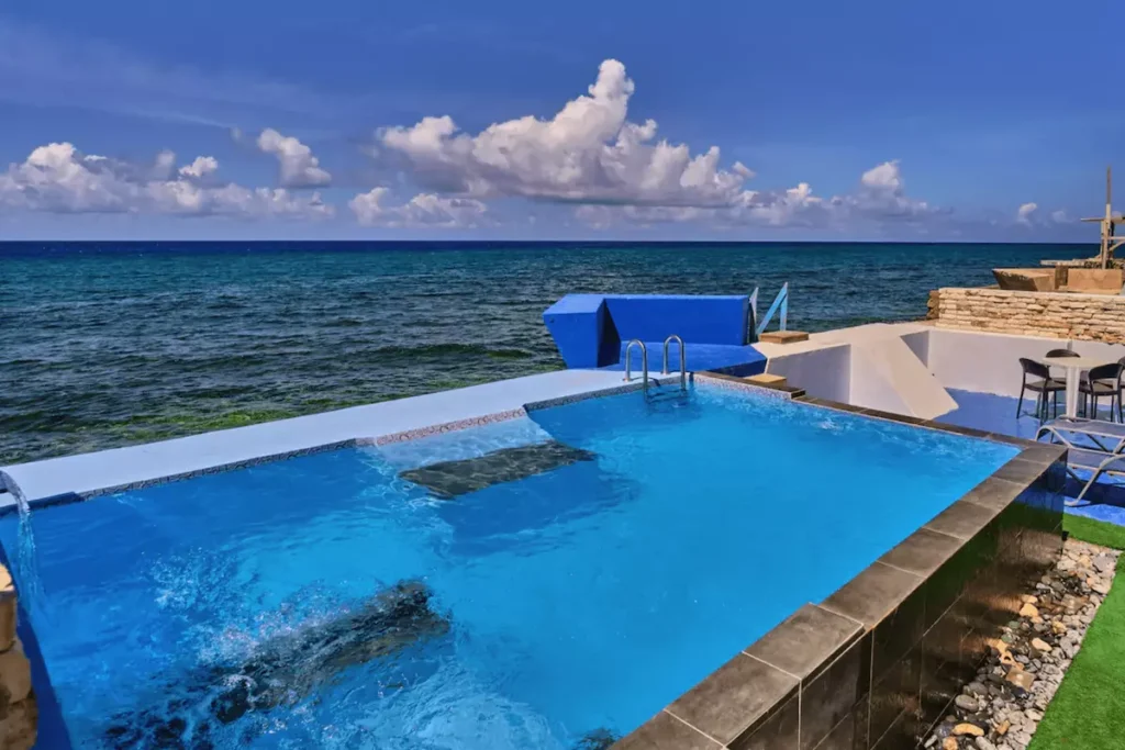 Infinity pool overlooking the sea at Villa Isis in Havana