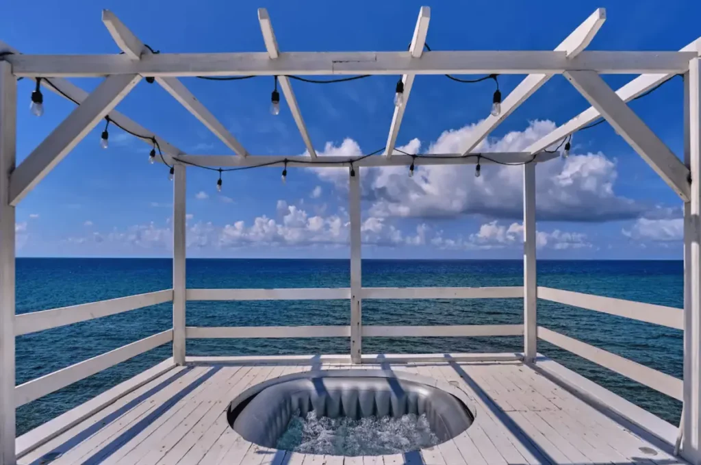 White pergola on a sea-facing Villa Isis terrace