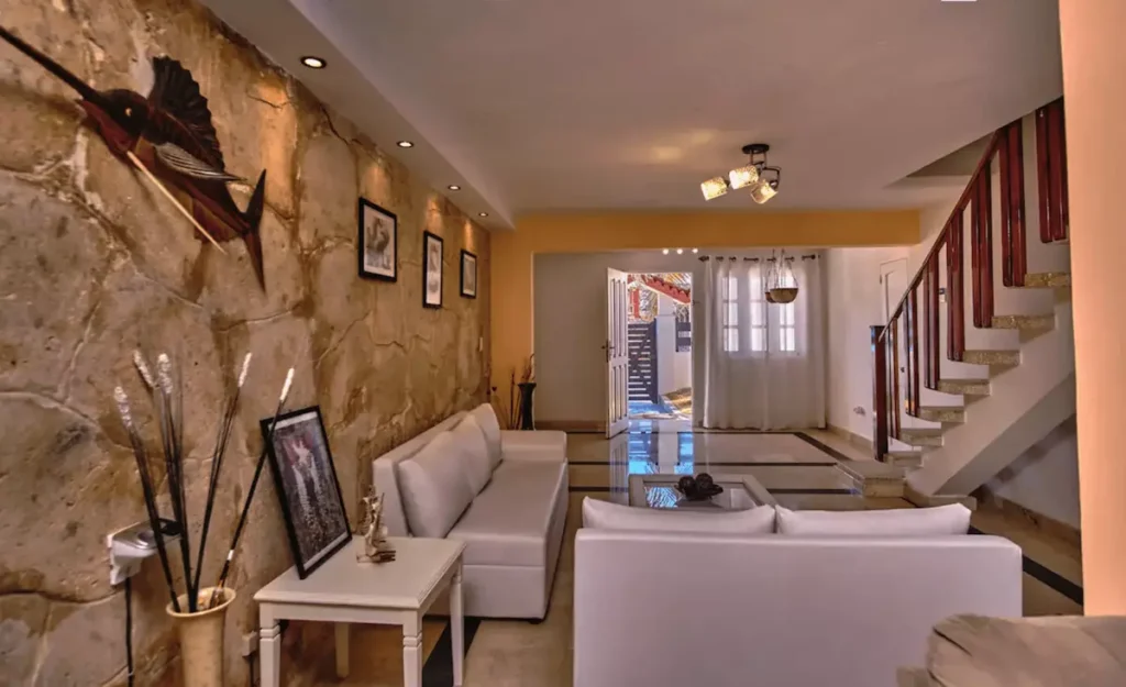 Shared living room and staircase inside Villa Isis