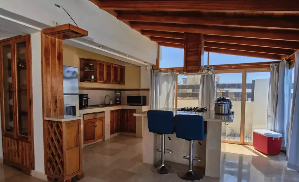 Kitchen and breakfast bar inside Villa Isis