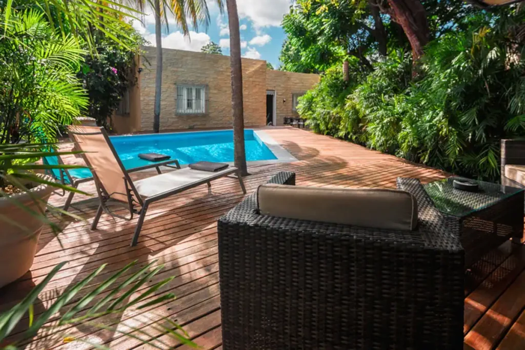 Garden pool terrace and lounge seating at Villa Las Cañas
