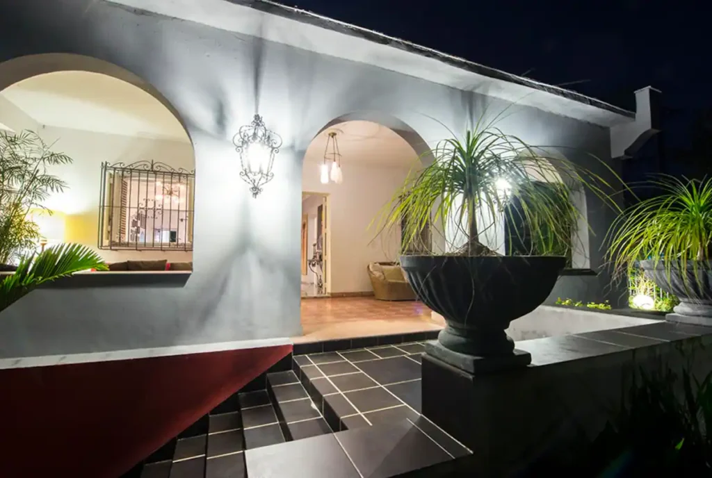 Illuminated courtyard exterior at Villa Las Cañas
