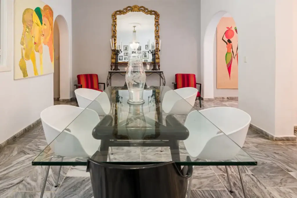 Glass dining table and contemporary art at Villa Las Cañas