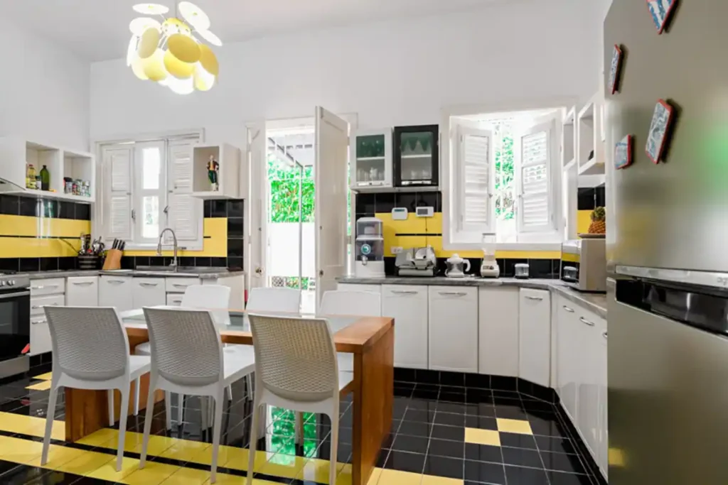 Black white and yellow kitchen at Villa Las Cañas