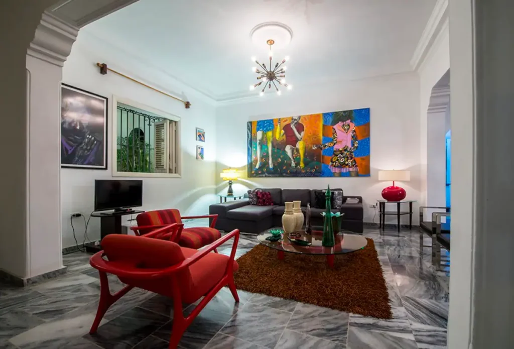 Art-filled sitting room inside Villa Las Cañas