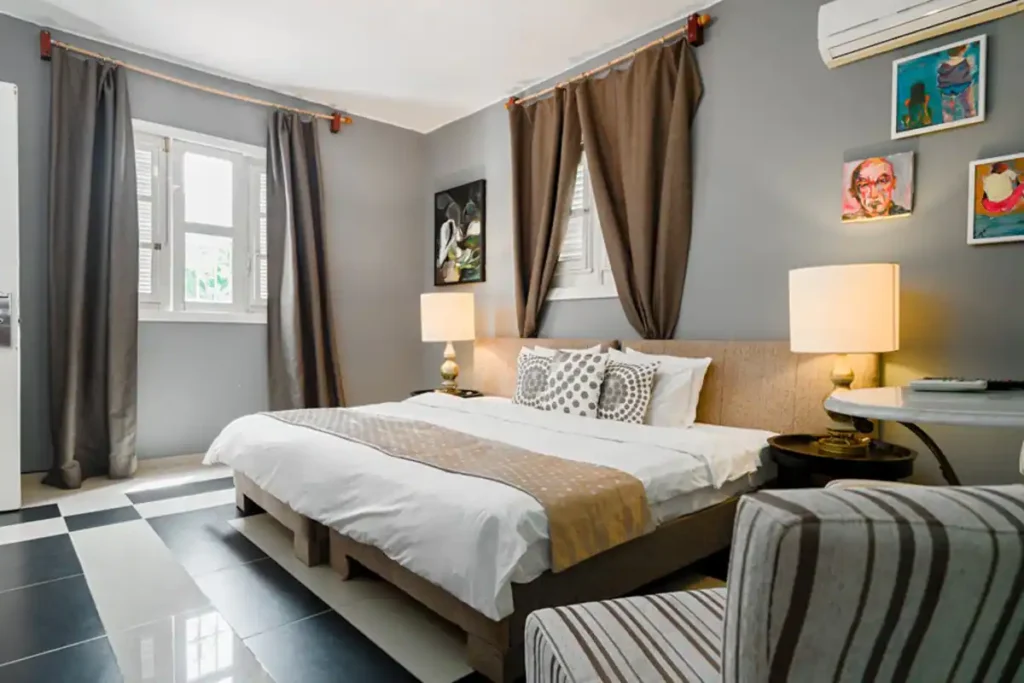 King bedroom with grey feature wall at Villa Las Cañas