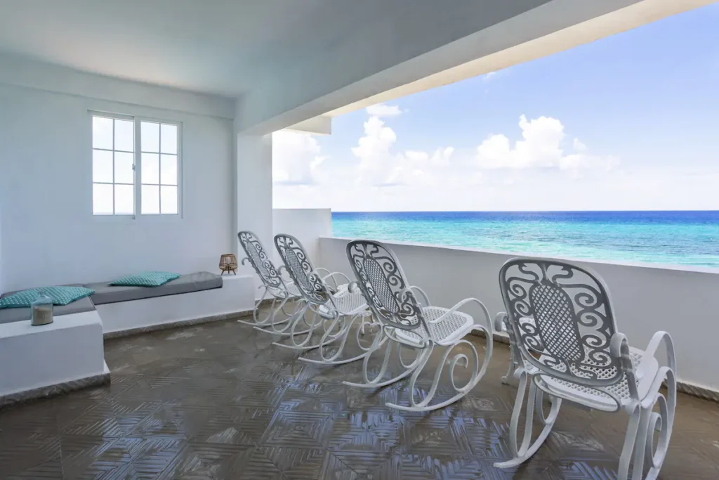 Upper sea-view terrace with chairs at Villa Luca
