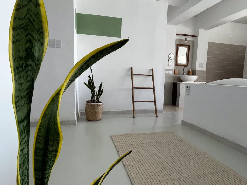 Bedroom interior with open bathroom at Villa Luca