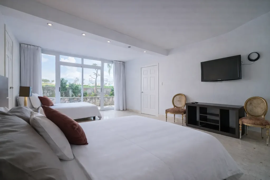 Large bedroom opening towards the garden at Luxury Rio Mar