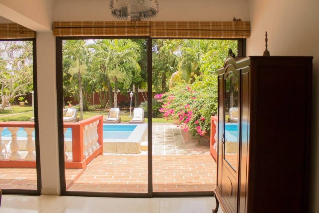 Bedroom opening towards the garden at Villa Maison