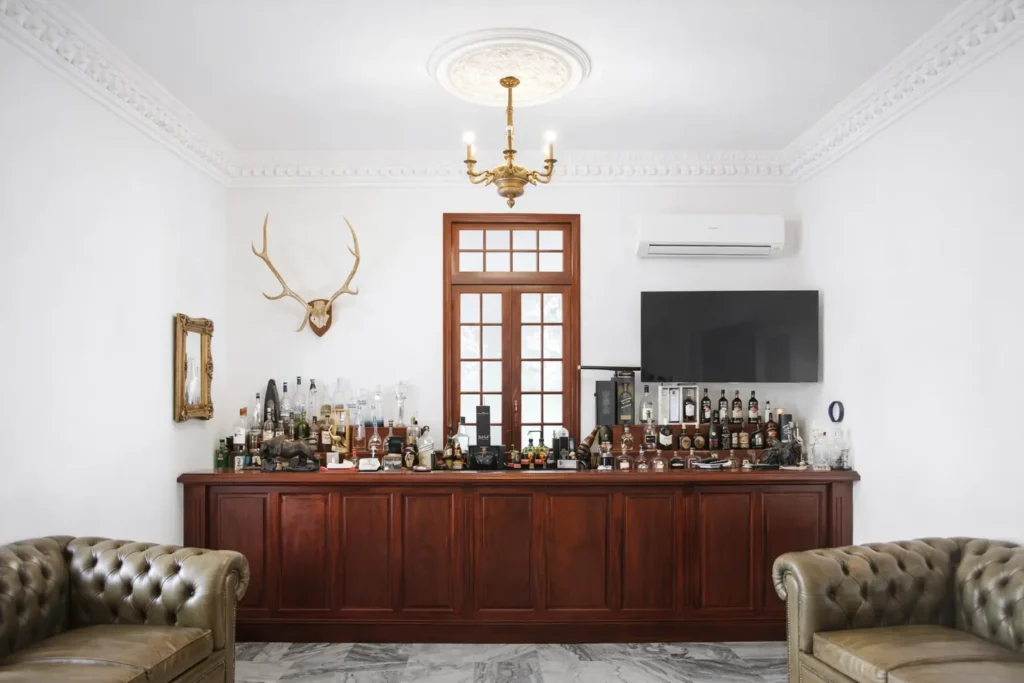 Indoor bar with leather seating at Villa Pat