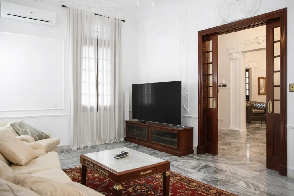 Classic lounge with television at Villa Pat