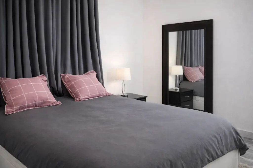 King bedroom with charcoal bedding at Villa Pat