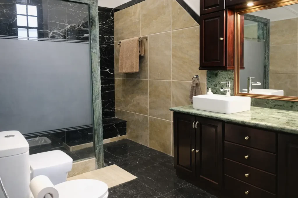 Walk-in shower and stone bathroom at Villa Pat