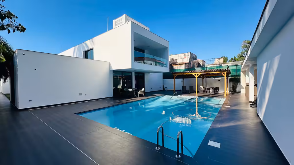 Villa Venezia modern white exterior and private pool in Miramar, Havana
