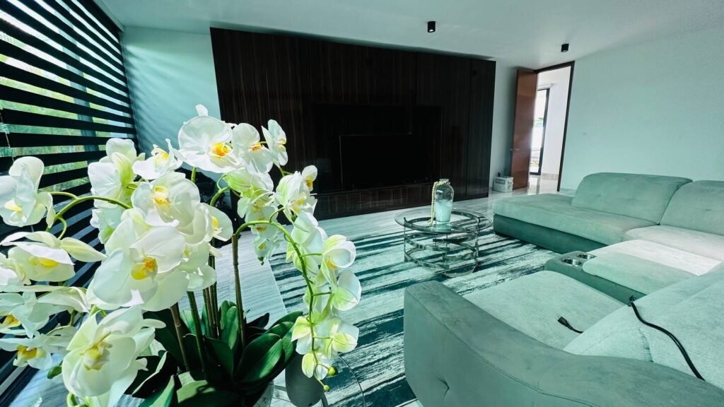 Television lounge with dark wood cabinetry at Villa Venezia