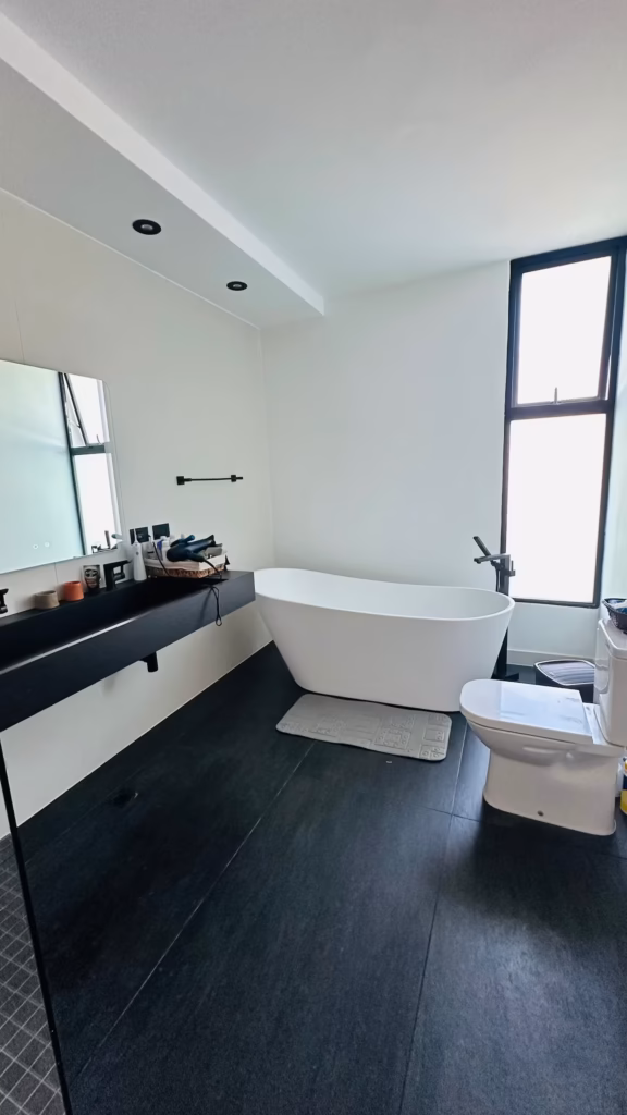 Private bathroom with freestanding bathtub at Villa Venezia