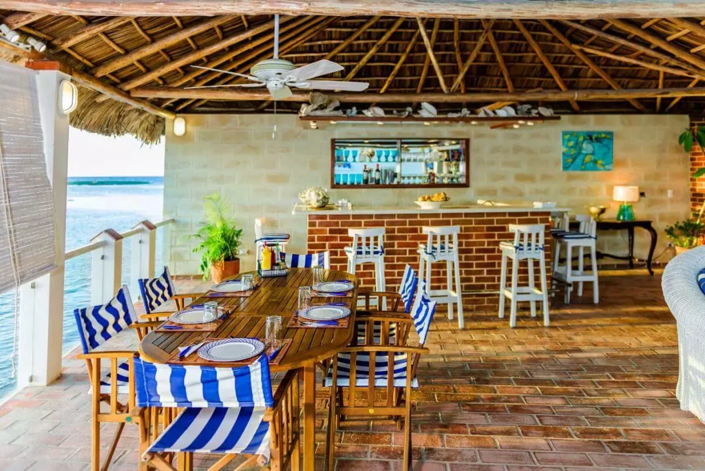 Outdoor dining and bar beneath the Villa Yan open-air pavilion