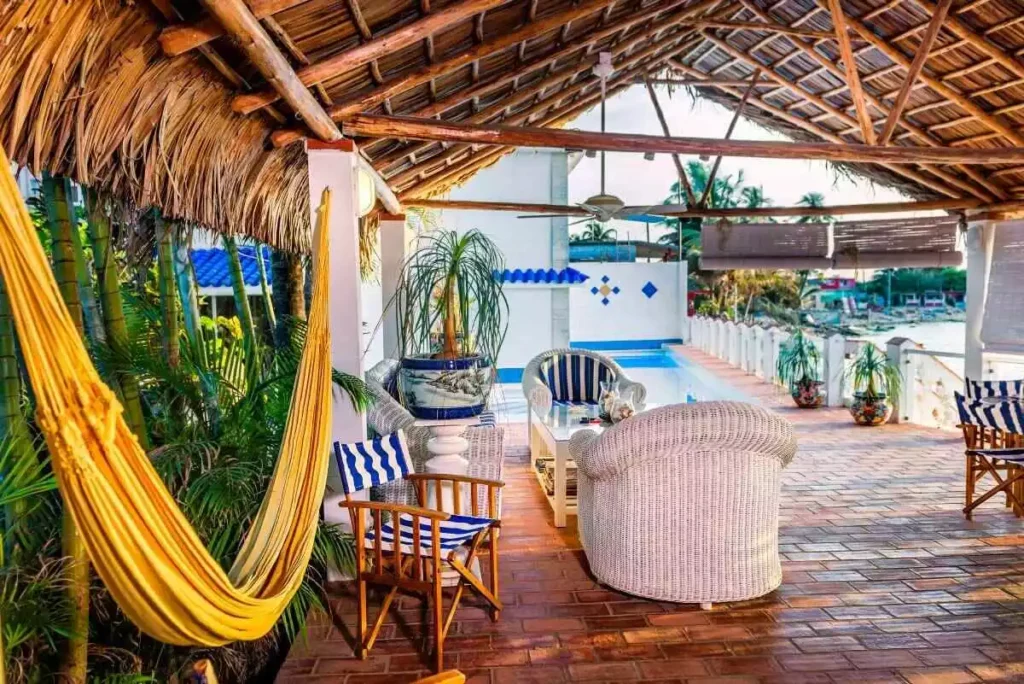 Hammock and lounge seating beneath the Villa Yan open-air pavilion