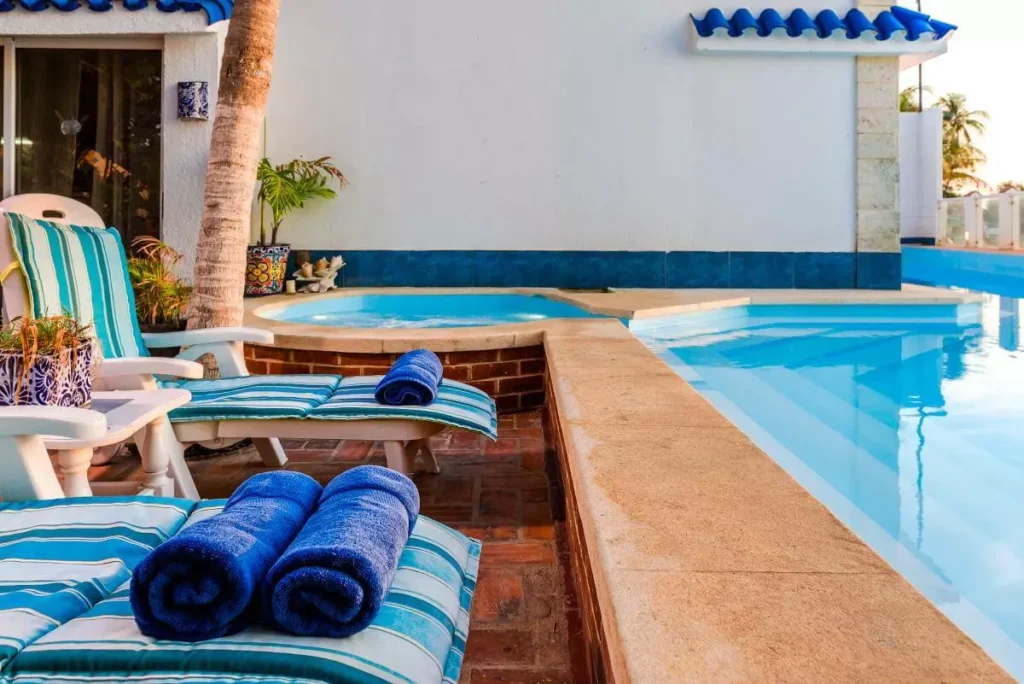 Pool loungers and blue towels at Villa Yan
