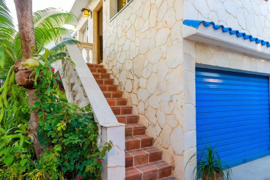 Exterior staircase with blue accents at Villa Yan